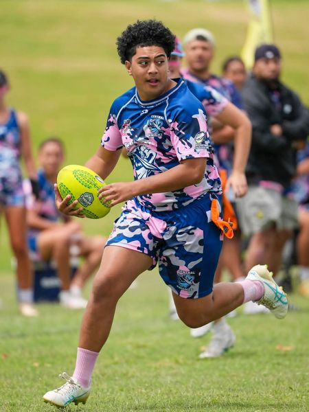 Tag football player running with ball