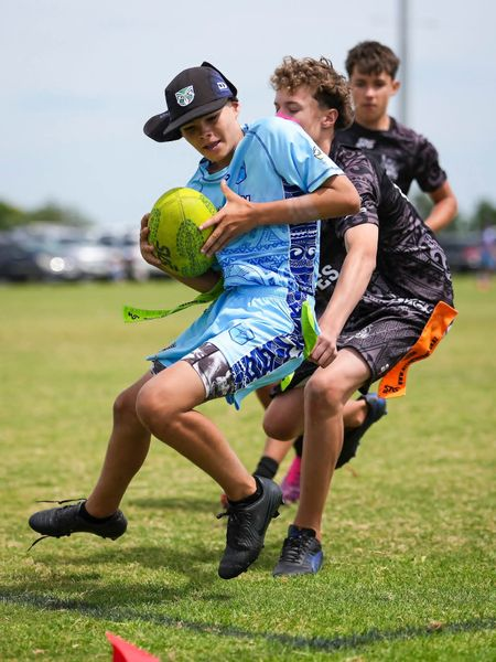 Tag football player carrying ball