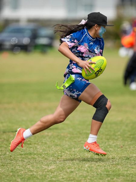 Tag football player on attack